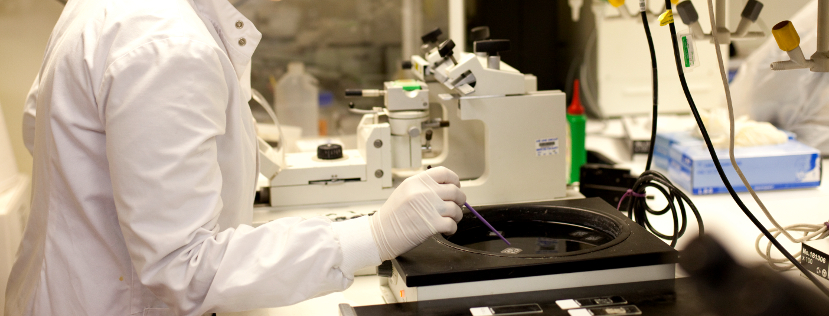 Scientist at centrifuge