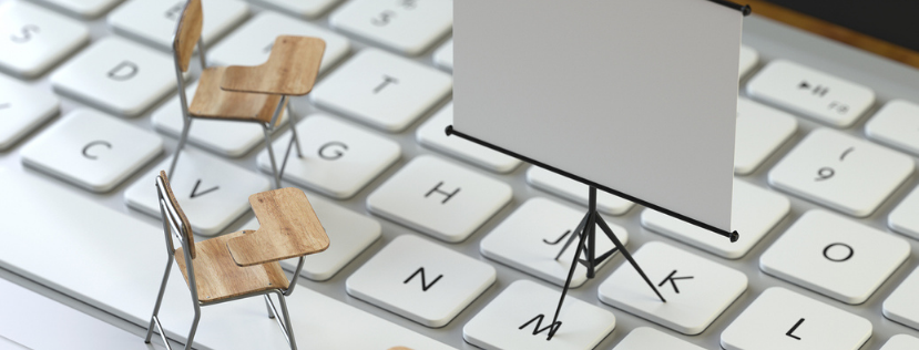 Mini chair and projector screen on keyboard