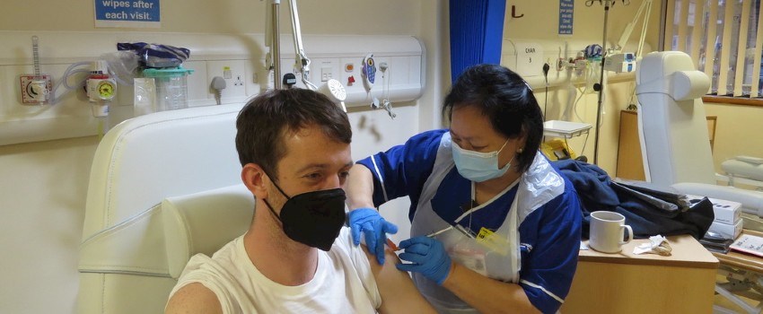 A man receives a vaccine