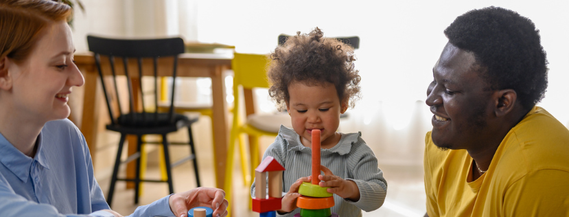 Parents playing with child