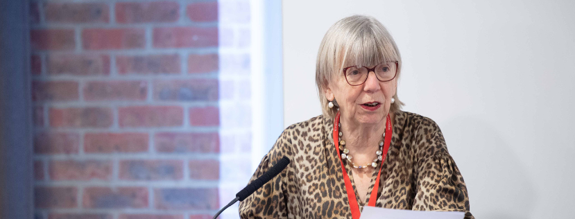 Professor Ulrike Schmidt standing at lectern