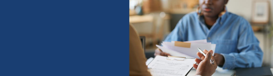 picture of black person looking at paperwork 