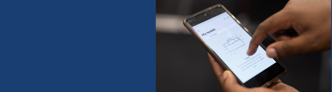 Person on their phone looking at a screen that reads 'toolkit'