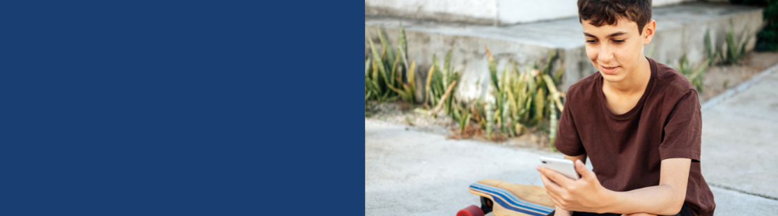 A teenage boy using his phone 