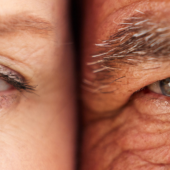 Close-up of an older couple's eyes side by side, showing wrinkles and different eye colors