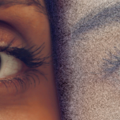 Close-up of a human eye on the left with detailed iris reflection, juxtaposed with a sketch-like rendition of an eye on the right