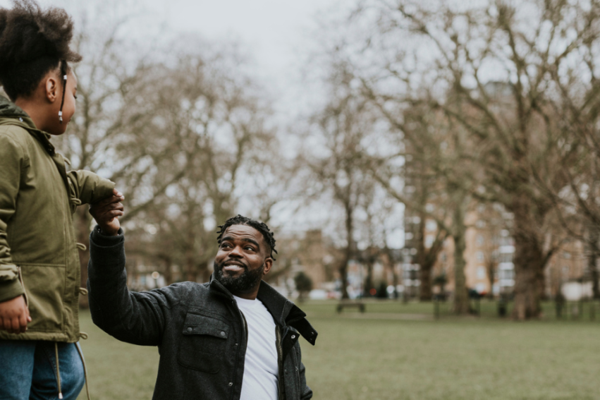 A parent and child in a park