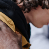 A young man being supported