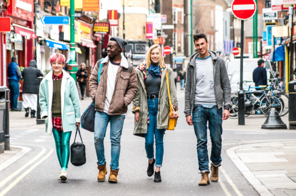 young people walking in brick lane, London