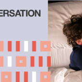 Child sleeping peacefully, wearing headbands with sensors, cuddling a teddy bear. Text on left reads 