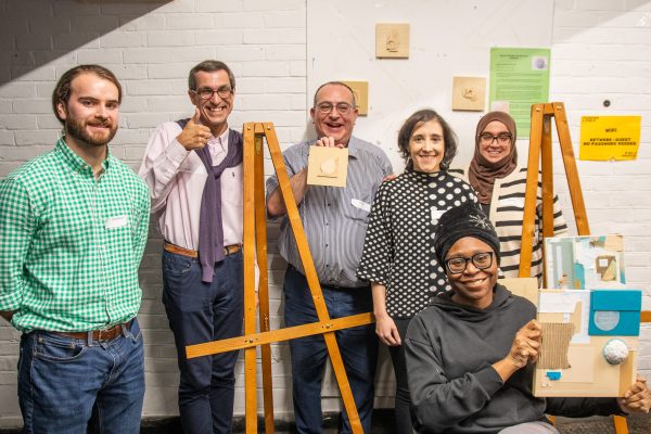 Group of participants and EDI leads at event with art