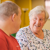 Two adults in conversation
