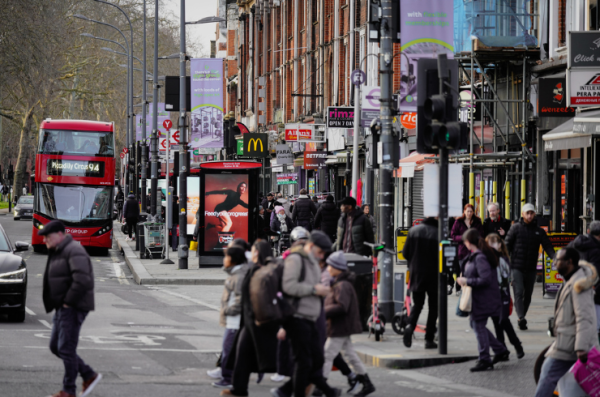 london photo people on street with bus