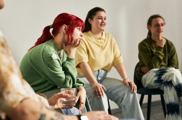 girl with red hair in a group of people