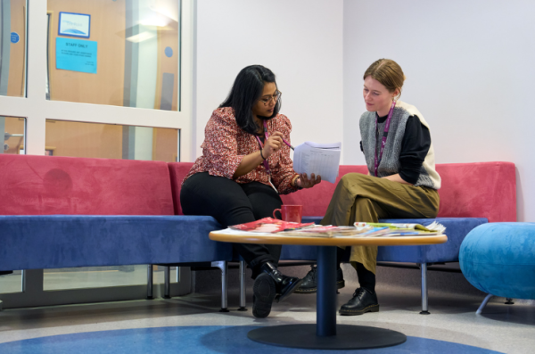 Consent for Contact R&D two people talking looking at a form