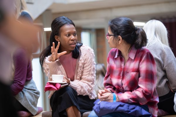 Two researchers talking over coffee