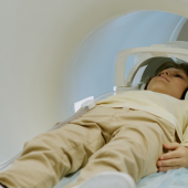 Child Lying Inside Mri Scanner Undergoing Medical Imaging Procedure