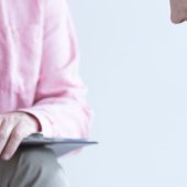 Two people talking in a therapy session