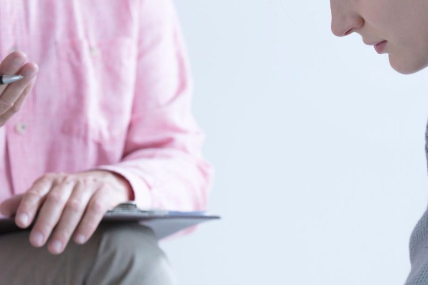 Two people talking in a therapy session