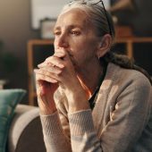 Older woman looks into distance