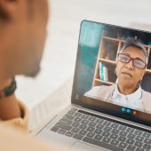 Laptop, video call and mental health with virtual counseling consultation, doctor and patient with communication