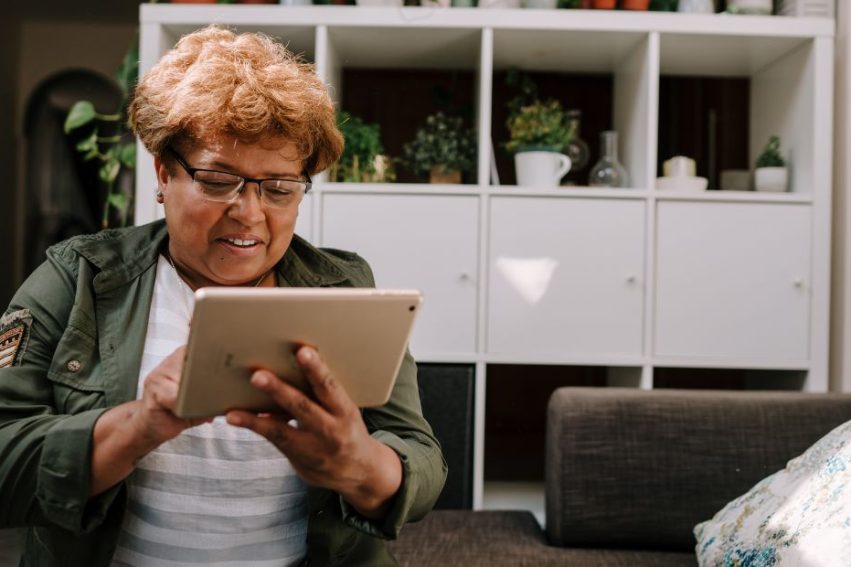 woman using ipad at home