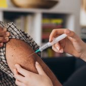 man receiving covid vaccine