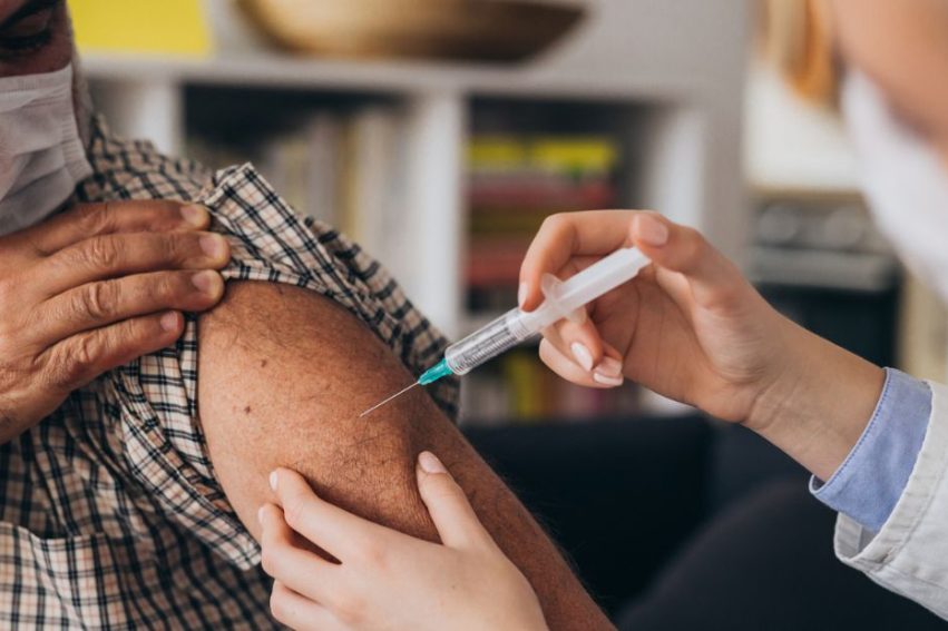 man receiving covid vaccine