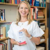 Saskia Sanderosn holding NIHR IMpact Prize commendation