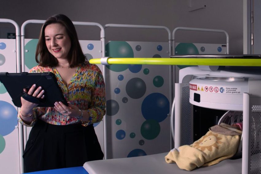 portabe scanner with baby and researcher